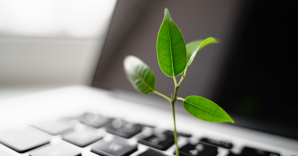 A laptop with a sprout, representing growth and change for legal teams