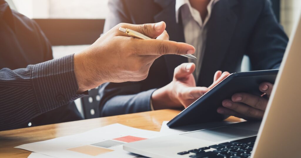 Modern Legal operations playbook and ai for legal teams - worker pointing to their device.