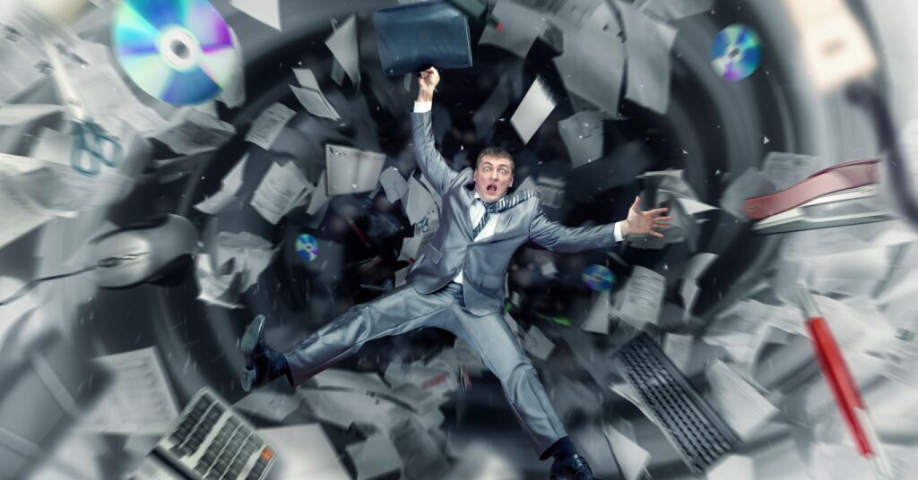 legal professional falling down around his work stuff, showing chaos from his legal intake issues