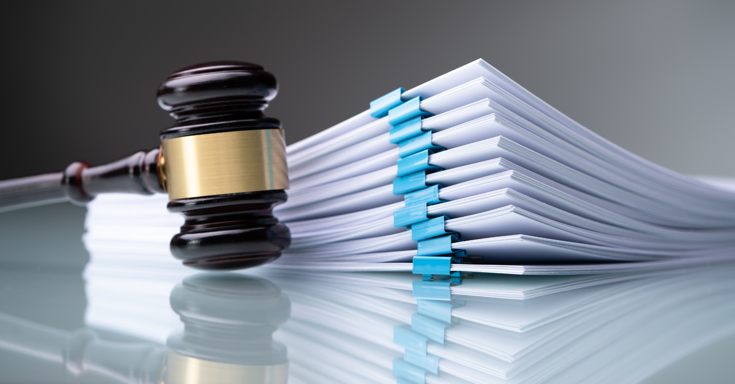 Judge's gavel beside organized legal case files representing court case management, legal document organization, and judicial administration.