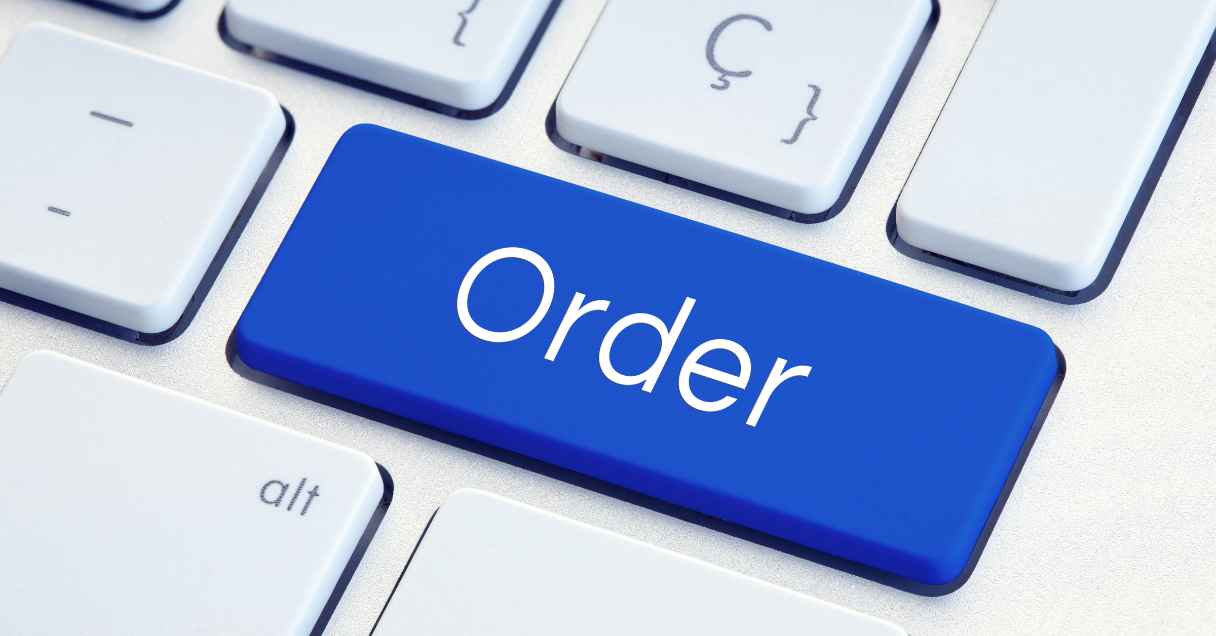 Close-up of a computer keyboard with a blue Order key representing government purchase card procurement and streamlined legal technology purchasing.